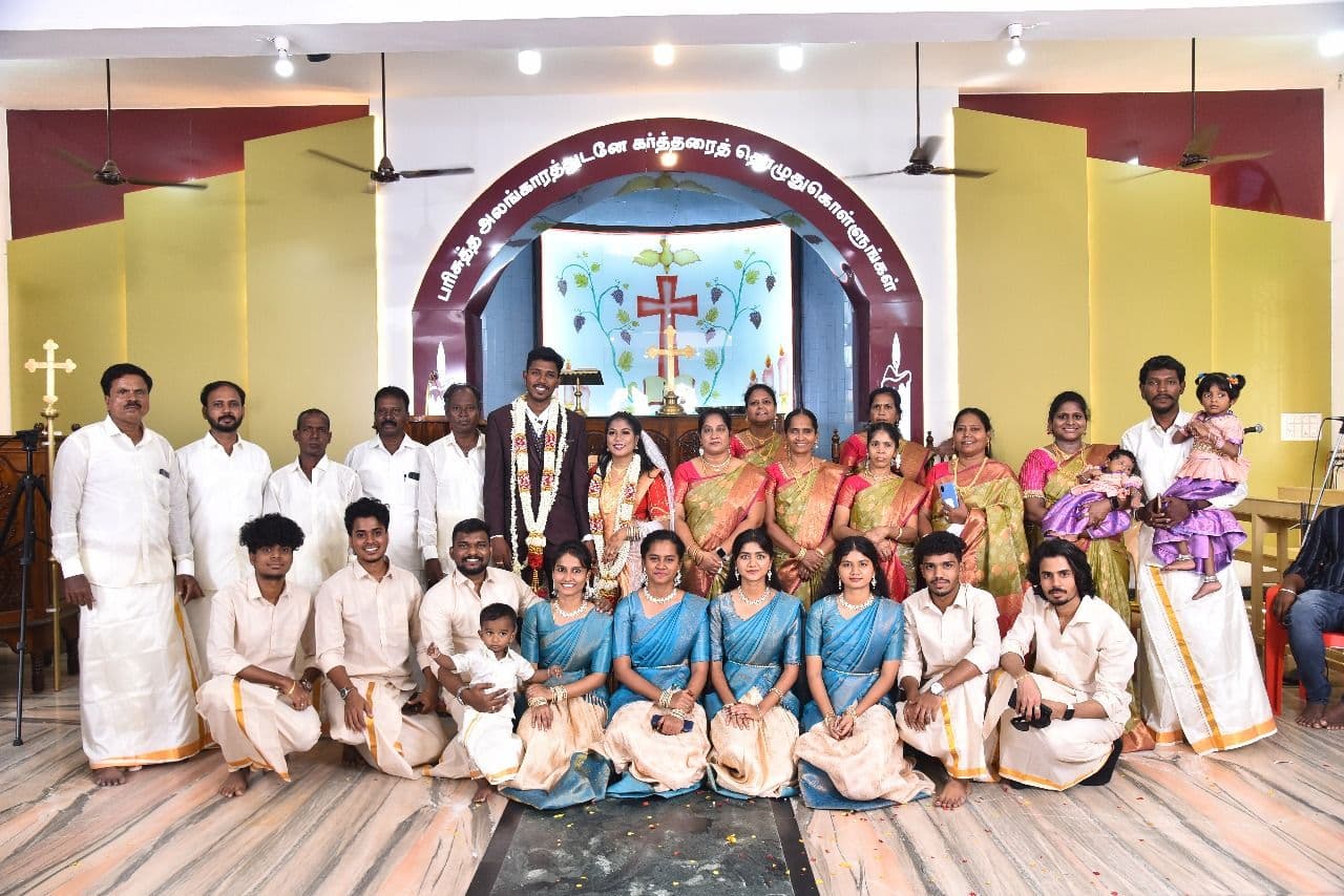 Large family and friends group photo at church wedding ceremony